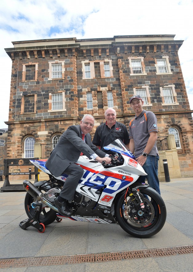 Road racing stars take no prisoners at 2015 Metzeler Ulster Grand Prix launch Some of the biggest names in real road racing have gathered in the historic setting of Belfast’s Crumlin Road Gaol to officially launch the 2015 Metzeler Ulster Grand Prix.  An all-star line up including Ian Hutchinson, Glenn Irwin, Dean Harrison, Dan Kneen, Peter Hickman and Paul Owen were placed on ‘parole’ as they gave fans an exciting preview of what’s in store during Bike Week and discussed their seasons so far.  Pictured is Regional Development Minister Danny Kennedy with Noel Johnston, Clerk of the Course at the Metzeler Ulster Grand Prix and racer Peter Hickman.