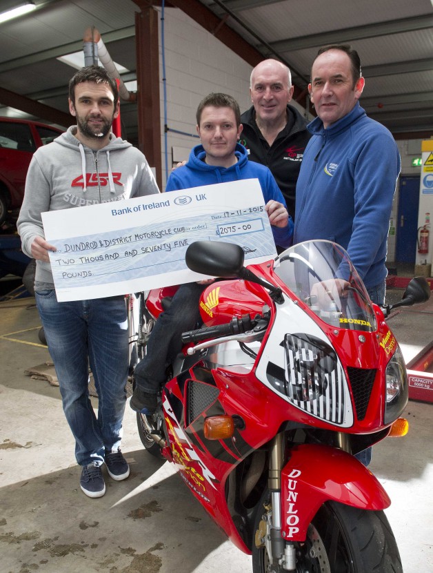 Cheque mate: Noel Johnston, UGP Clerk of the Course, with William Dunlop, Joey's son Gary Dunlop and Russell Shiels. 