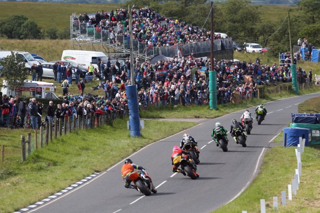 A huge crowd watch the Superstock race action at Quarry Bends at the 2015 Ulster Grand Prix.